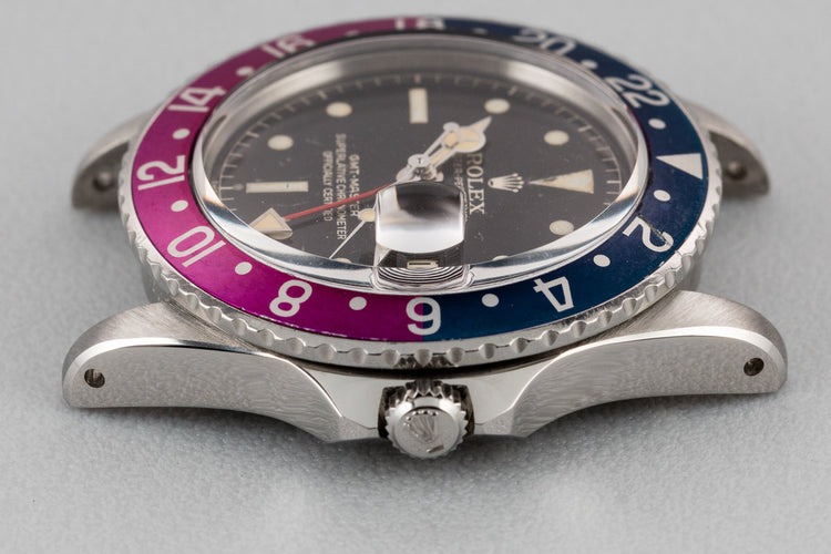 1960 Rolex GMT-Master 1675 with Pointed Crown Guard Case, Gilt Exclamation Dial, and Fuchsia Bezel Insert with Papers