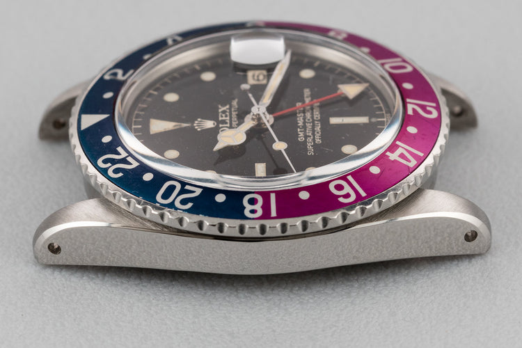 1960 Rolex GMT-Master 1675 with Pointed Crown Guard Case, Gilt Exclamation Dial, and Fuchsia Bezel Insert with Papers