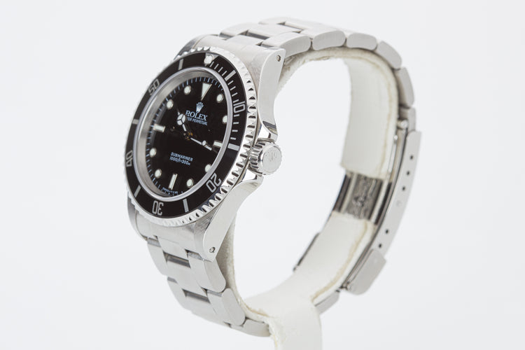 1998 Rolex Submariner 14060 with Box, Papers, Hangtag and Cloth.