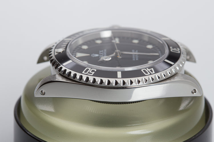 1998 Rolex Submariner 14060 with Box, Papers, Hangtag and Cloth.