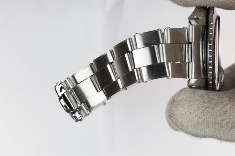 1960 Rolex GMT-Master 1675 with Pointed Crown Guard Case, Gilt Exclamation Dial, and Fuchsia Bezel Insert with Papers