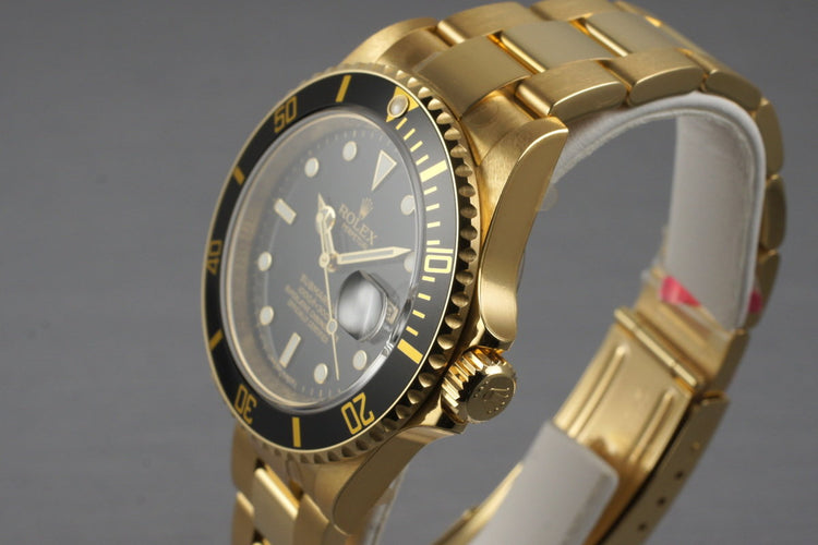 2006 Rolex YG Submariner 16618 with Box and Papers MINT with stickers
