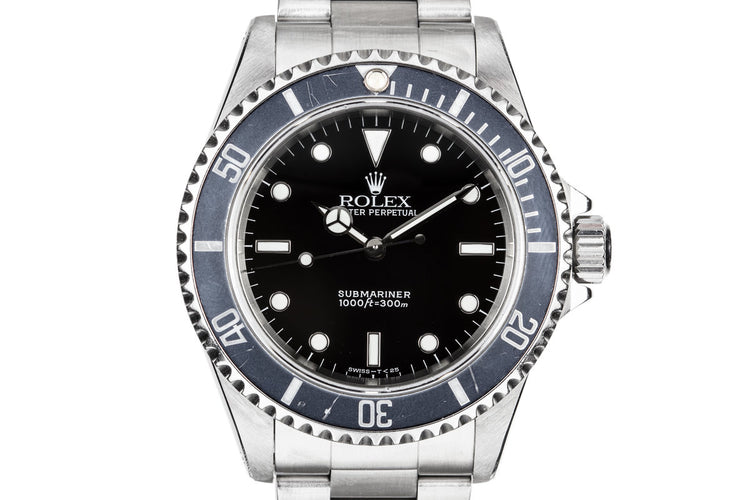 1995 Rolex Submariner 14060 with Faded bezel insert.
