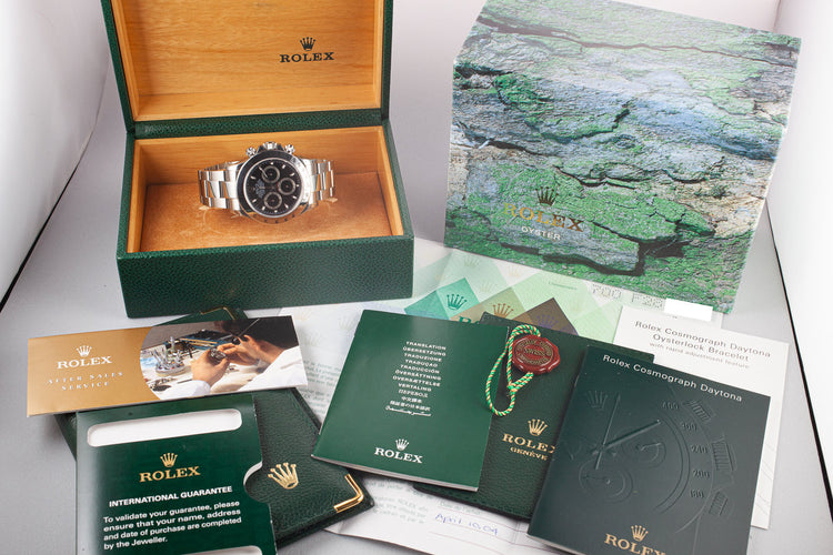 2003 Rolex Daytona 116520 Black Dial Still In Factory Protective Stickers with Box and Papers