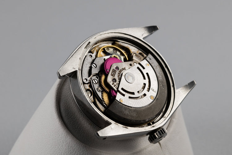 1967 Rolex Date 1500 Gilt Dial with Deep Ruby Tropical Patina