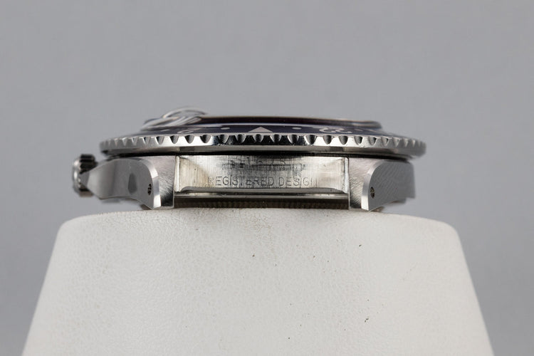 1960 Rolex GMT-Master 1675 with Pointed Crown Guard Case, Gilt Exclamation Dial, and Fuchsia Bezel Insert with Papers