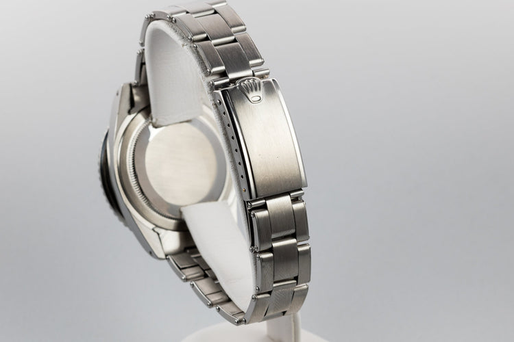 1960 Rolex GMT-Master 1675 with Pointed Crown Guard Case, Gilt Exclamation Dial, and Fuchsia Bezel Insert with Papers