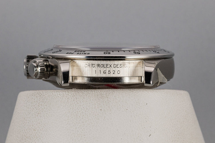 2003 Rolex Daytona 116520 Black Dial Still In Factory Protective Stickers with Box and Papers