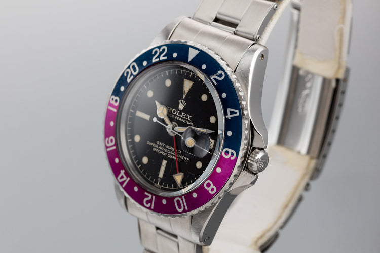 1960 Rolex GMT-Master 1675 with Pointed Crown Guard Case, Gilt Exclamation Dial, and Fuchsia Bezel Insert with Papers