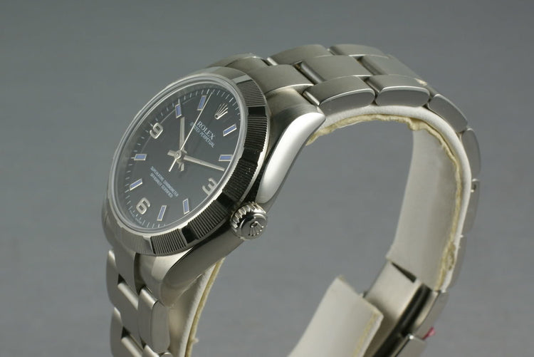Rolex Midsize Oyster Black Arabic Numbers and Blue Markers 177210