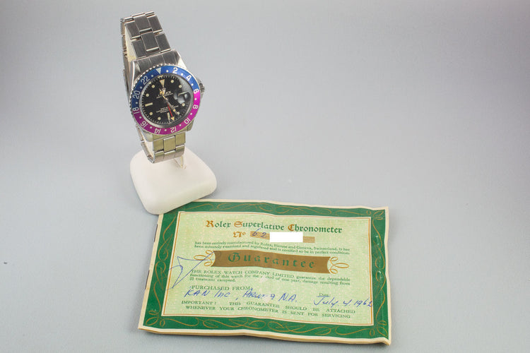 1960 Rolex GMT-Master 1675 with Pointed Crown Guard Case, Gilt Exclamation Dial, and Fuchsia Bezel Insert with Papers