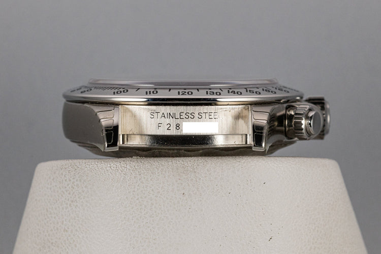 2003 Rolex Daytona 116520 Black Dial Still In Factory Protective Stickers with Box and Papers