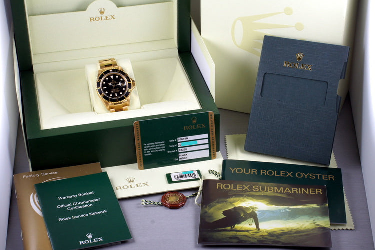 2006 Rolex YG Submariner 16618 with Box and Papers MINT with stickers
