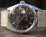 1971 Rolex Date Model 1500 with Gray Dial, Gilt Hands, Gilt Baton Markers on Strap with Service Papers