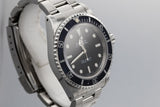 1995 Rolex Submariner 14060 with Faded bezel insert.