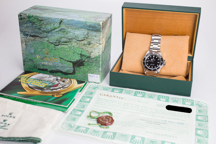 1998 Rolex Submariner 14060 with Box, Papers, Hangtag and Cloth.