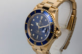 1999 Rolex 18K YG Submariner Blue Dial with Box and Papers