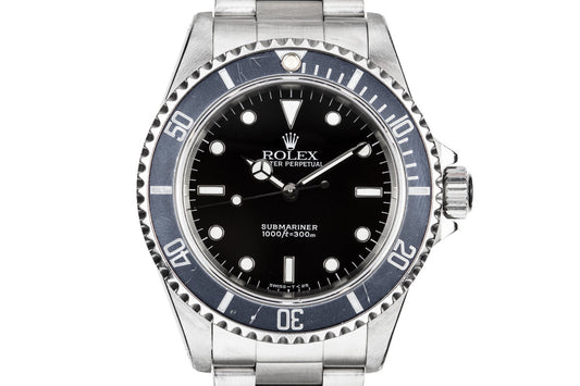 1995 Rolex Submariner 14060 with Faded bezel insert.