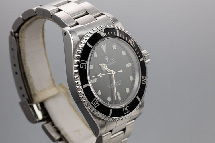 1999 Rolex  Submariner 14060 with SWISS Only Dial