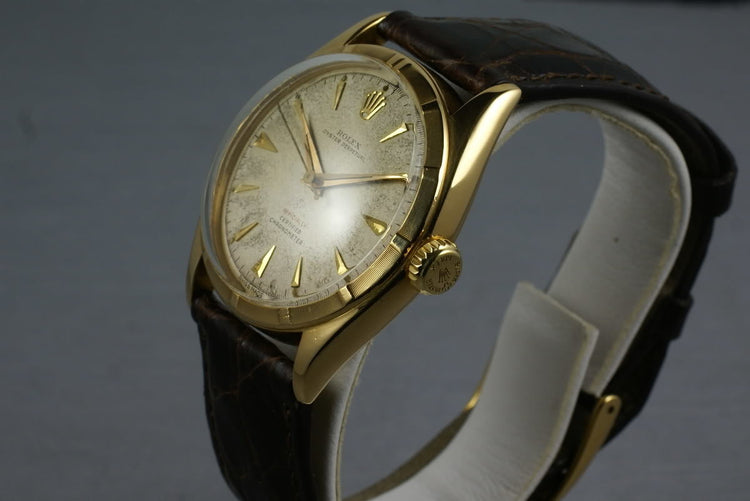 1952 Rolex 18K Oyster Perpetual 6085 with red “officially” on the dial