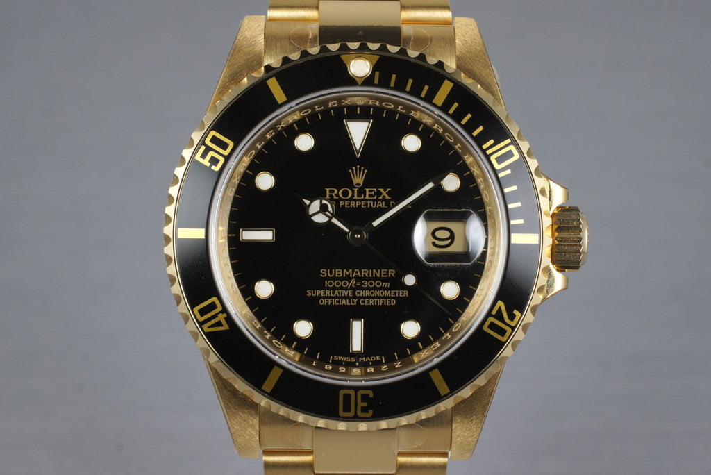 2006 Rolex YG Submariner 16618 with Box and Papers MINT with stickers