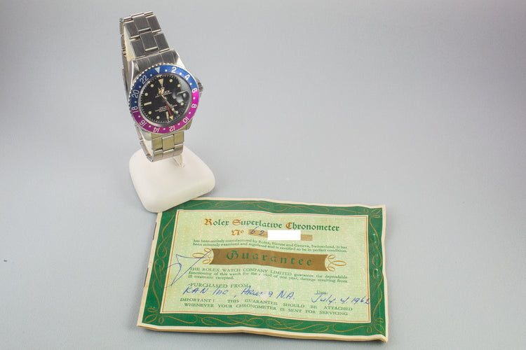 1960 Rolex GMT-Master 1675 with Pointed Crown Guard Case, Gilt Exclamation Dial, and Fuchsia Bezel Insert with Papers